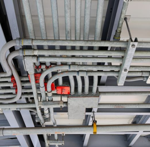 Steel,Tube,Fitting,,Electricity,And,Signal,Wire,Tubes,Attached,On